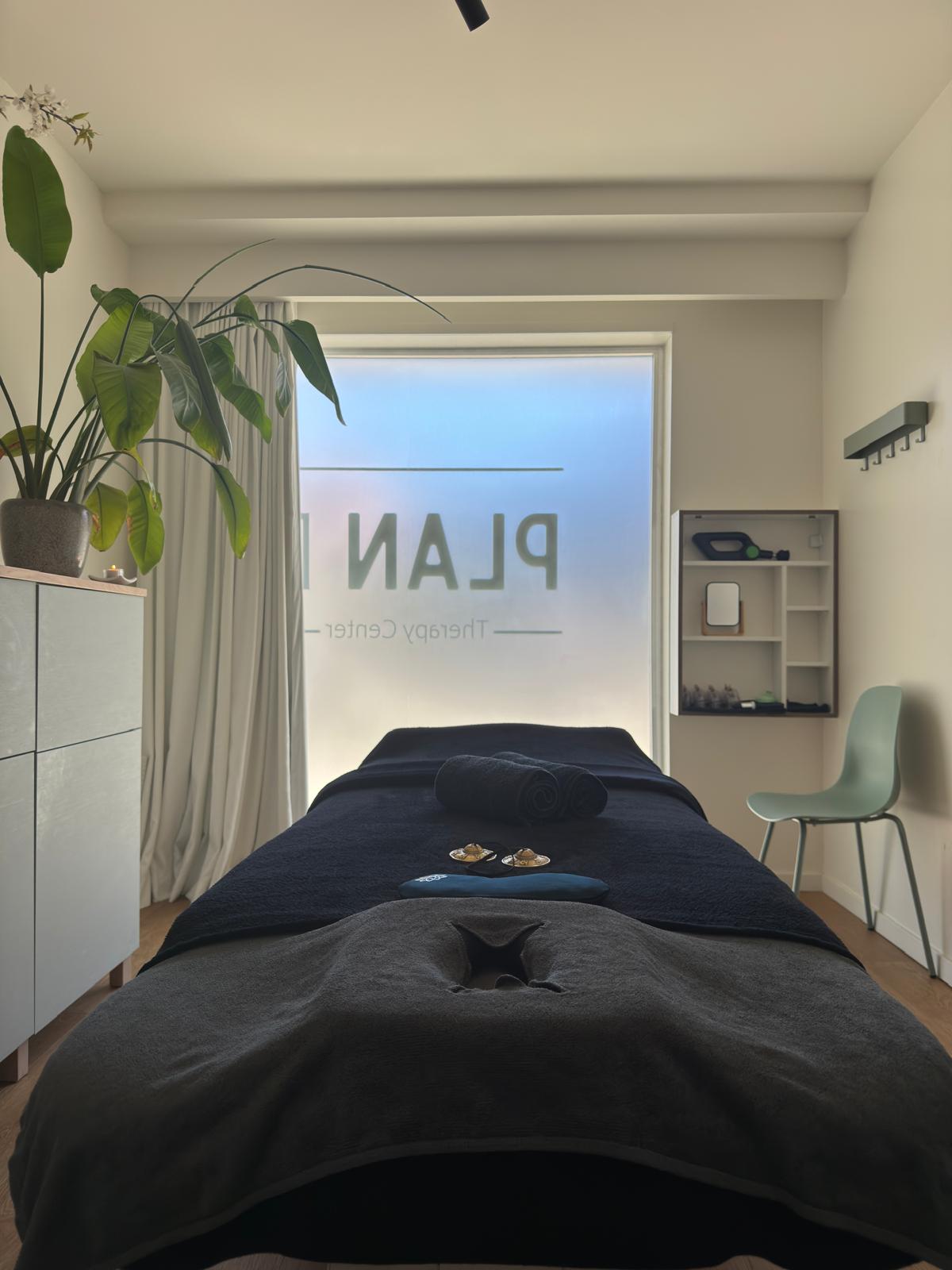 Massage treatment room at Caldas Massage in Antwerp, set up for a cupping therapy session